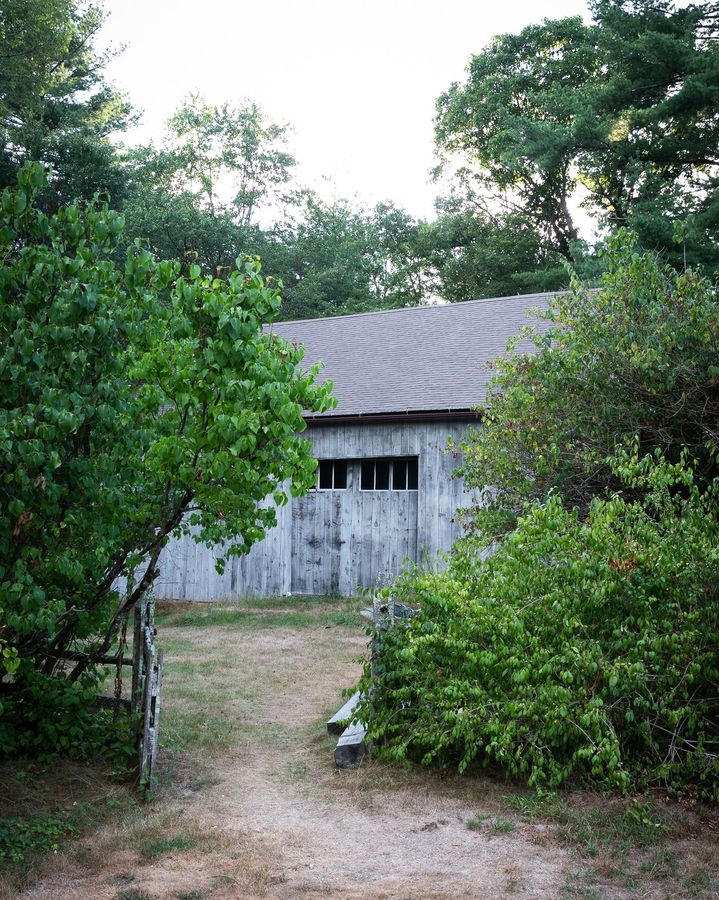 Weathered barn and outbuilding on the grounds of the Old Arnold Estate in need of ongoing upkeep