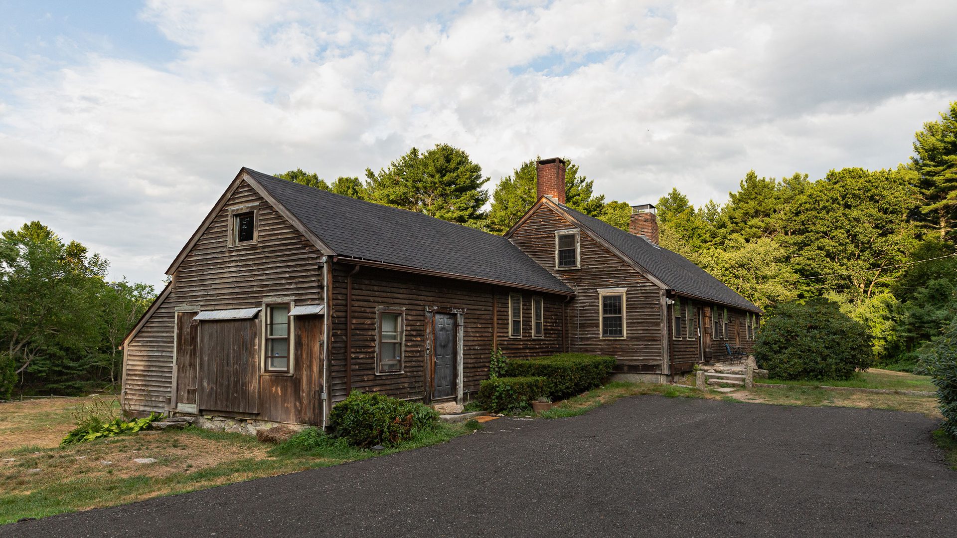 Front exterior view of the historic Old Arnold Estate farmhouse in Harrisville, Rhode Island