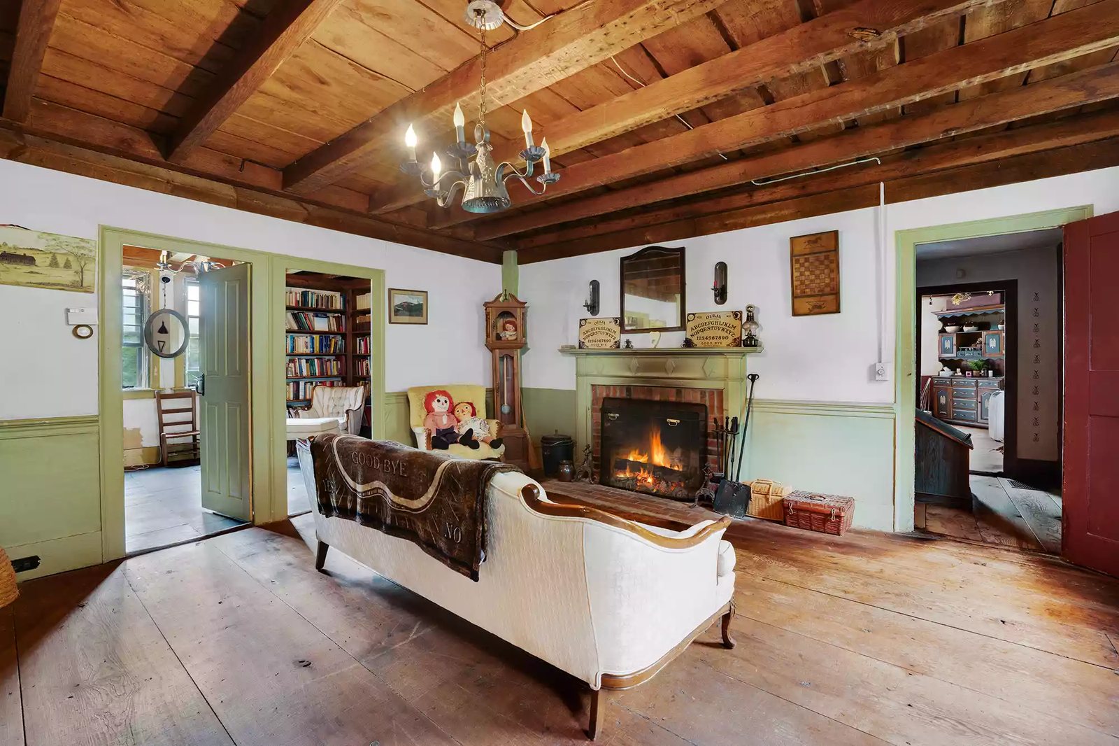 Living room with fireplace inside the historic farmhouse at the Old Arnold Estate